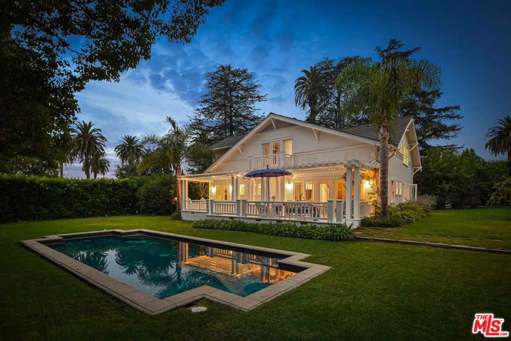 Welcome home. This secluded compound in Santa Monica features an inimitable two-story Craftsman nestled beyond tall hedges on a 23,190 square foot lot. This is a one-of-a-kind living opportunity amid one of the most coveted locales north of Montana. Showcasing spectacular architectural design from coved ceilings, arched doorways and a conservatory, all thoughtfully restored over the years, the home features a bright, airy floor plan, flowing effortlessly outside via glass French doors to one of Santa Monica's most extraordinary outdoor settings. The home offers 5-bedrooms and 4.5-bathrooms, inclusive of a main floor bedroom and the second-level primary retreat with vaulted ceilings, seating area with fireplace and a spa-like bath. Outside, find an expansive deck, lush, manicured gardens with mature fruit trees, a beautiful pool, detached one-bedroom guest home, and a large rustic barn that offer a dream-worthy sanctuary to relax, entertain and revel in year-round California living. Pairing authentic architectural details with inspiring natural surroundings, all while moments from San Vicente, this rare compound is ready to start its new chapter. OFFER DEADLINE: TUESDAY, 6/15 at 12:00PM.