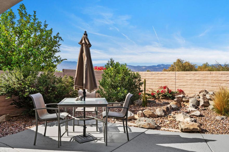 Welcome to this charming and freshly updated Canterra floor plan offering 1,257 sq. ft. of comfortable living space, ideally situated with a panoramic mountain view in Sun City Shadow Hills. The inviting great room features tile flooring, two large windows, and a sliding glass door that fills the space with natural light and provides easy access to the backyard. The kitchen showcases updated appliances with a newer refrigerator, dishwasher and microwave, granite countertops, and abundant cabinetry with room for a cozy breakfast nook. A separate laundry room adds everyday convenience. The AC was recently replaced in 2023 and heating system updated in 2024. The primary suite offers luxury vinyl tile, a large picture window overlooking the backyard and mountain views, a walk-in closet, and an ensuite bathroom with dual vanities and a shower stall. The guest bedroom, also with LVT flooring, is located near a full bath with a shower-over-tub combination perfect for visitors. The garage has been updated with insulated garage doors and built-in storage. Step outside to enjoy a spacious backyard featuring a covered patio, extended concrete area ideal for outdoor seating, and low maintenance desert landscaping. This beautiful move-in ready home was painted inside and out in the last 12 months. Sun City Shadow Hills is an active 55+ community offering resort-style amenities, including two clubhouses, championship golf courses, fitness centers, pools and spas, pickleball and tennis courts, and a variety of social clubs and activities designed for every interest. Enjoy the perfect blend of recreation, relaxation, and connection in this vibrant desert community. Don't miss the opportunity to make this inviting Canterra yours!