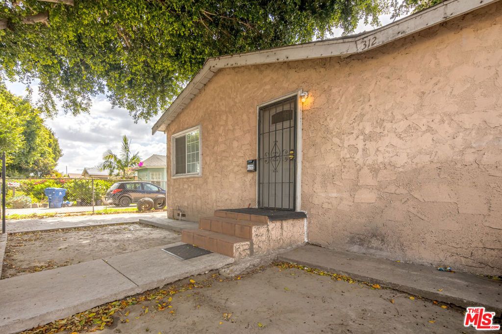 Photo of 312 E 92nd Street, Los Angeles, CA 90003 (MLS # 26641567)