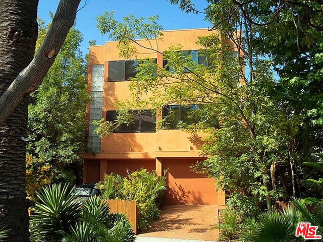 Contemporary side-by-side duplex built in 2008. Units are mirror imaged - each with 3 bedrooms, 2 baths. Direct access two car garage on first level. Second level offers living room with fireplace and built-ins, kitchen, bedroom and bath. The third floor has sitting/office area, 2 bedrooms, and a bathroom. Both units have glass brick accents, central AC/heat, wine cooler, tankless water heater, in wall vacuum, laundry in garage, alarm system, and their own private back patio. Owner's unit has soaking tub and private roof top deck.