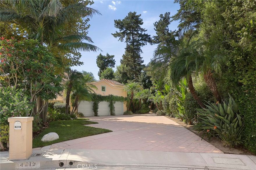 Located on a private, gated street, this architectural home offers a rare blend of sophistication, comfort, and resort-style living. Far from the typical home, it’s designed to inspire—balancing striking design with a warm, livable flow ideal for an active way of living and effortless entertaining. Step through the grand foyer into a beautifully appointed interior where natural light, soaring ceilings, and dramatic architectural elements create an atmosphere of elegance and ease. The chef’s kitchen opens seamlessly to the expansive living and dining areas, perfect for gatherings both large and intimate. The first level features two generous bedrooms sharing a Jack-and-Jill bath, plus an additional ensuite bedroom and a convenient laundry room. Upstairs, the spectacular primary retreat feels like a private sanctuary—complete with a loft, romantic fireplace, private balcony, and great natural light. The sumptuous bath features dual vanities, a spa tub, separate shower, and a spacious walk-in closet. Additional highlights include a 3-car garage with direct access, a modern home security system, and an adaptable floor plan that can be easily customized to suit any taste or design aesthetic. Outdoors, the home truly shines—a private backyard oasis surrounded by mature trees and lush greenery. Enjoy a tranquil pool and spa, BBQ center, and patio designed for entertaining or relaxing. The PRIVATE TENNIS COURT is easily converted to a PICKLEBALL COURT, or the space could be reimagined as a guest house, music studio, or other creative retreat, offering endless possibilities on this large, beautiful lot. This house is a vibe—architectural, private, and truly a rare find.