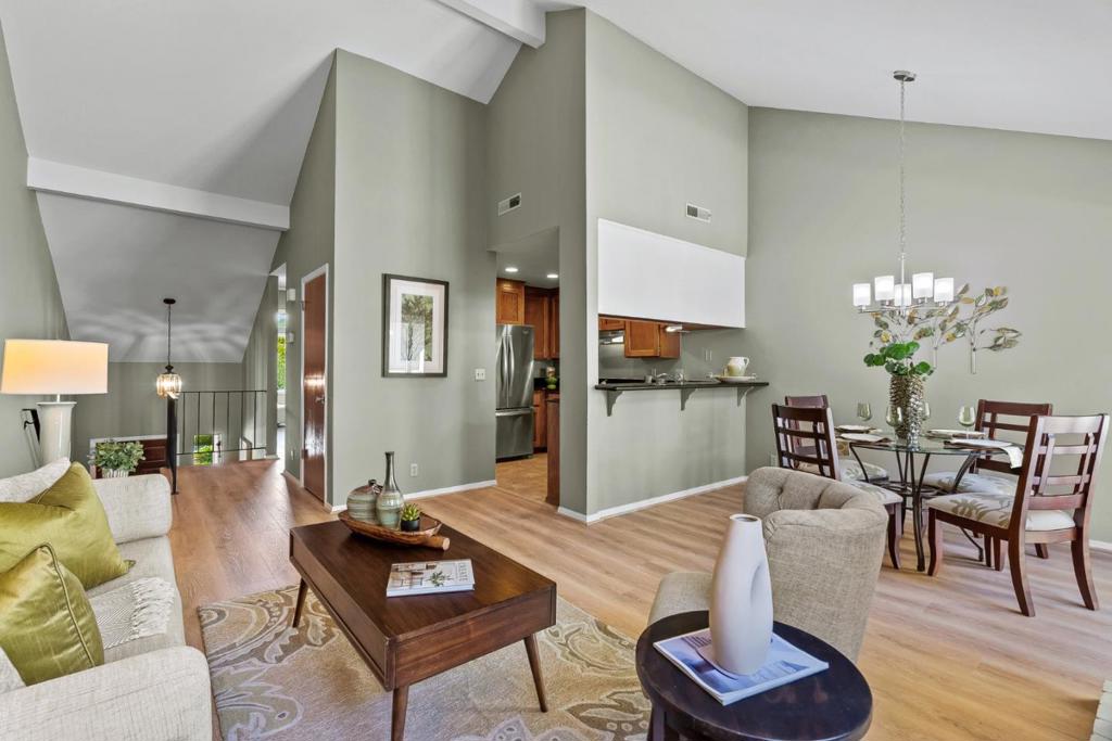 Welcome to 29 Arabian Way, a warm and well-cared-for townhome nestled in the desirable Scottsborough community. This 3-bedroom, 2-bath home features vaulted ceilings, a fireplace, and plenty of natural light. The spacious living room opens to a deck perfect for relaxing. The kitchen and dining area flow comfortably together, with thoughtful updates made throughout the home over time. The primary suite offers generous closet space and a private bath, while the two additional bedrooms provide flexibility for guests, a home office, or creative space. Downstairs, a fenced outdoor patio offers space for a small garden, pets, or peaceful outdoor time. You'll appreciate the attached garage, in-unit laundry, and storage. Community amenities include a pool, and maintained grounds. Located just minutes from shopping, dining, Skypark, and top-rated Scotts Valley schools with an easy commute over the hill, this home offers the perfect blend of comfort, convenience, and community.