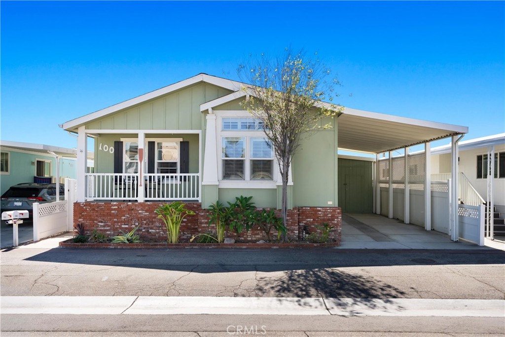 This is the beach house you have been dreaming about! Located in the highly sought after Huntington Shore Cliffs community, and within a short walk or bike ride to the sands of world famous Huntington Beach, downtown, the pier, Pacific City, restaurants, shopping, and so much more, this immaculately upgraded 1,560 square foot double wide manufactured home features 3 spacious bedrooms with high ceilings, 2 spa-like upgraded bathrooms that look like they belong in a magazine, a large living room complete with a gorgeous fireplace and high ceilings, a gourmet kitchen featuring granite countertops, high end stainless steel appliances, plentiful gorgeous cabinetry, a large center island, and a cozy breakfast nook. In addition, the home features a spacious dining room, an interior laundry room complete with cabinetry and a sink, an abundance of windows with plantation shutters and doors with screens throughout the home to let in the cool ocean breezes and natural light, as well as LED recessed lighting, ceiling fans, gorgeous stone and laminate flooring throughout the home, and central air conditioning and heating. The outside of this home is just as special as the inside. The home features a gorgeous general style that includes a front porch, a 2 car covered car port with secure storage, and a spacious private back yard complete with shade structures, and gorgeous hardscaping. The Huntington Shore Cliffs community is an immaculate community filled with great homes, great neighbors, a resort like pool and spa, clubhouse, and on site management. This home is immaculate and one of a kind. Don't miss out!