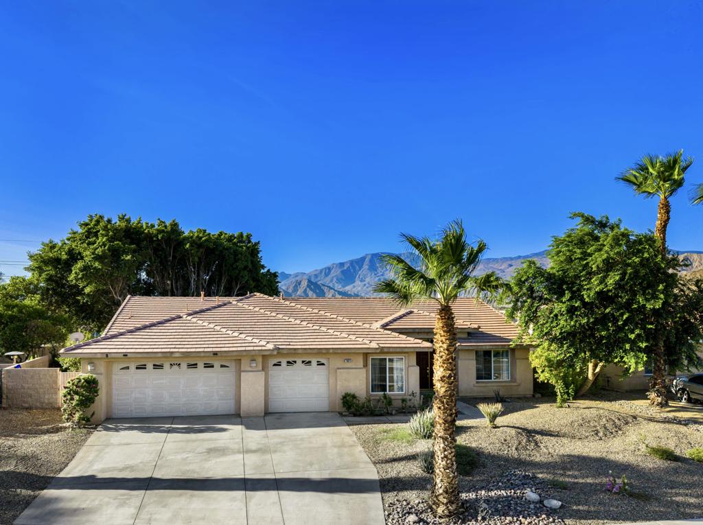 Welcome Home to La Quinta. This desirable Marbella floor plan is located in a sought-after North La Quinta neighborhood, nestled on a scenic Mountain View lot with incredible Panoramic Mountain Views. This Spacious single-level home offers a bright, freshly painted interior with new flooring throughout, featuring over 2100 square feet of living space, 4 bedrooms and 2 full baths. The open-concept kitchen includes a large kitchen island, gas range, pantry, ample storage and a separate dining area, blending style with functionality. Generous living spaces include a large living room and a separate family room with a cozy fireplace--perfect for both relaxation and entertaining. Enjoy low-maintenance landscaping in the front and backyards, Incredible Views, plus a spacious 3-car garage. Ideally located and within walking distance to shopping and dining, La Quinta Park, La Quinta High School and Easy access to i10 freeway and Highway 111. Close proximity to Old Town La Quinta, and venues for Coachella and Stage Coach festivals. This lovely home is perfect for those seeking both the comforts of home and maximum convenience.