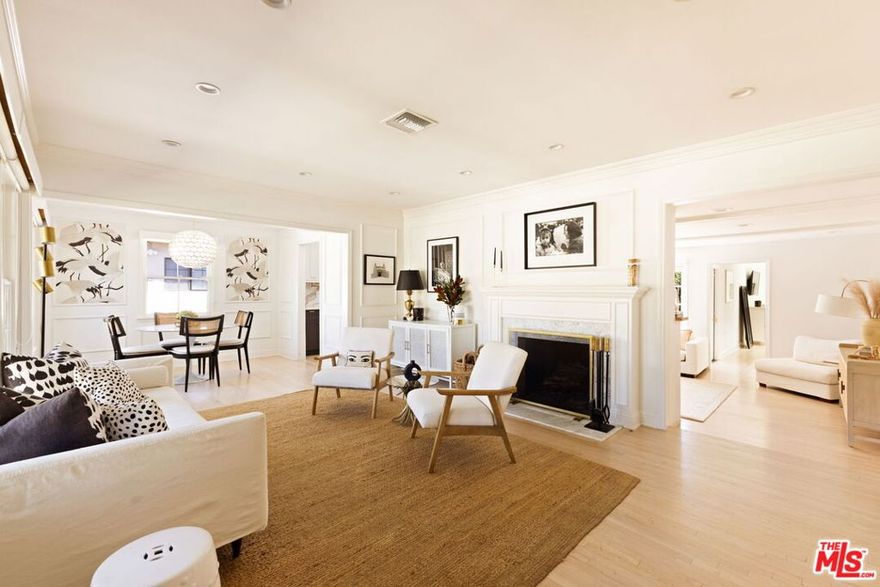 On a quiet, tree-lined street in one of the most desirable areas of Sherman Oaks, this one level Ranch Traditional is a rare find. Completely renovated inside and out, this turnkey home is a true oasis. Step up to the lovely front porch and enter one of two living rooms with large picture windows, flooding natural light, and a beautiful fireplace. The designer dining room and completely renovated kitchen featuring top of the line finishes and appliances is wonderful for formal and informal gatherings. A second sunken living room off the kitchen features vaulted ceilings, a second fireplace and ample space to entertain. A convenient half bathroom nearby is ideal for guests. The spacious and bright primary suite features an Elfa custom closet system along with direct backyard access through picturesque French doors. The bathroom has a beautiful frameless glass shower enclosure with a dual sink vanity. Two additional spacious secondary bedrooms share an updated full bath with shower, tub and vanity. The garage has been stunningly converted into an unpermitted 400+ square foot detached guest house with a bedroom and a bathroom, along with a brand new cabinet system and sliding glass doors. It can also be used as a home office or studio and has a new storage shed behind it. Head outside to a lush resort-style backyard and a stunning pool with a waterfall and spa - an idyllic space for relaxing and hosting guests. With brand new low maintenance turf, a lounging area, a built-in BBQ center and a swim up bar, it's better than any hotel. Additional features include solar panels on the house that generate about 90% of normal household usage, a brand new laundry room and mudroom, new hardwood floors throughout the main home, a new HVAC system and a new tankless water heater.  Minutes from great shopping and restaurants along Ventura Blvd and close to many elite schools, this home is the perfect blend of luxury, privacy and convenience.