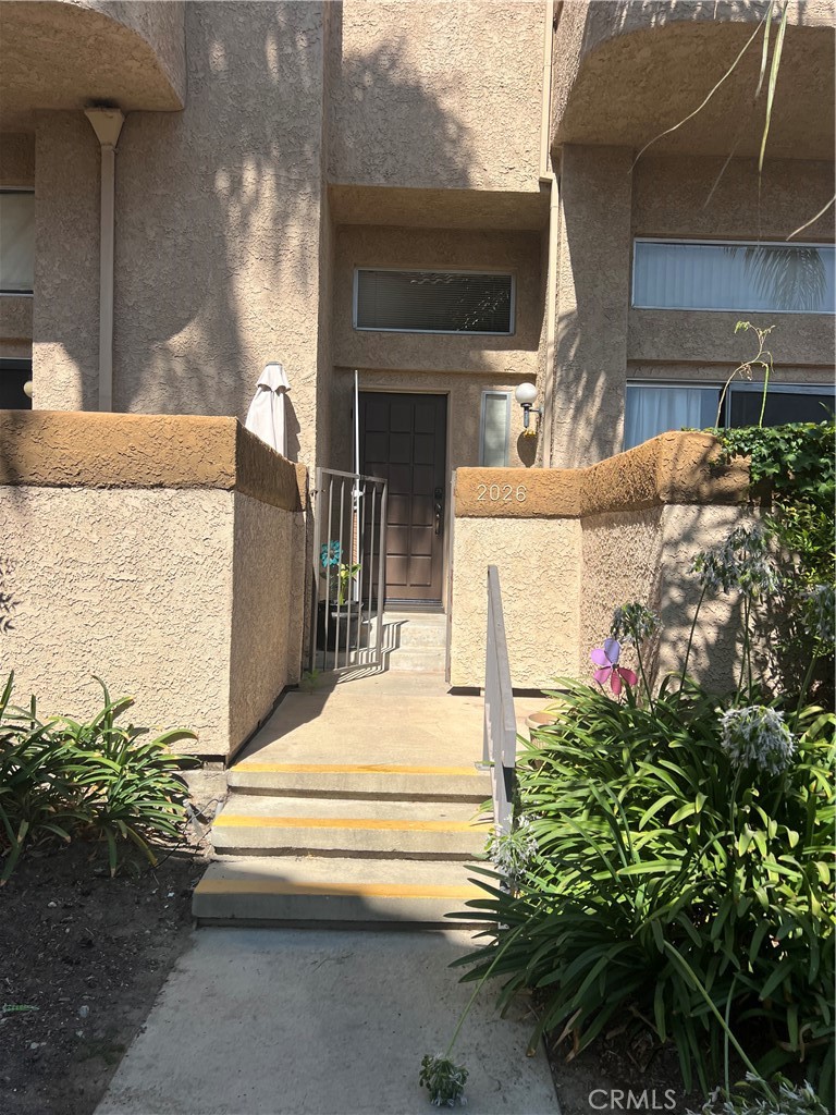 Charming 3 bedroom, 2.5 bath, spacious, 1460 sqft condominium, corner unit, new A C installed. Located walking distance to Elementary School. Bright and airy living space on the first floor with a half bath. Few Steps down to the attached 2- car-garage. Second floor has a spacious dining area and kitchen, with an eating space, and a closet for the laundry area in the kitchen. Third floor has 3 bedrooms and two full baths. Two Private balconies and patio area in the front. The unit has assigned parking in the two car garage plus permitted guest parking available for visitors. Just minutes away from 60 freeway and Grove, shopping centers, restaurants and local parks. Enjoy the shared pool, picnic area. Walking distance to school and park.