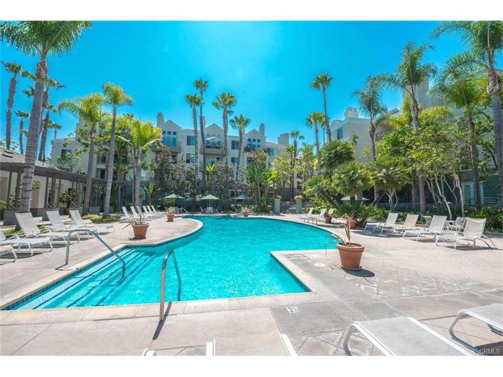Resort style living at the beautiful Metropolitan! This very sought after unit has a rare storage closet on balcony. Highly upgraded inside, this beautifully condo includes beautiful high quality stone flooring in entry, kitchen and bathrooms, extra custom-built cabinetry added in kitchen and granite countertops, lush new carpeting in living room and bedrooms. This unique condo has two bedrooms, each containing highly upgraded bathrooms and 3 huge closets. Primary bathroom has all new expanded walk-in shower and free-standing soaking tub. All new stone counters and sinks. Guest bathroom also has new walk-in shower with stone and marble finishings. New cabinets and stone counters as well. There are 9-foot ceilings, crown and base moldings and a gas starter fireplace with a marble mantle. The upgraded kitchen includes stainless steel appliances, new refrigerator and washer and dryer all included.. Community amenities feature a resort-style pool and spa, gym, guard and an exclusive clubhouse. The Metropolitan is close to Fashion Island, John Wayne Airport, UC Irvine, and South Coast Plaza. Enjoy prime access to the I-405, 55, and 73 freeways. Hurry, this one won’t last!