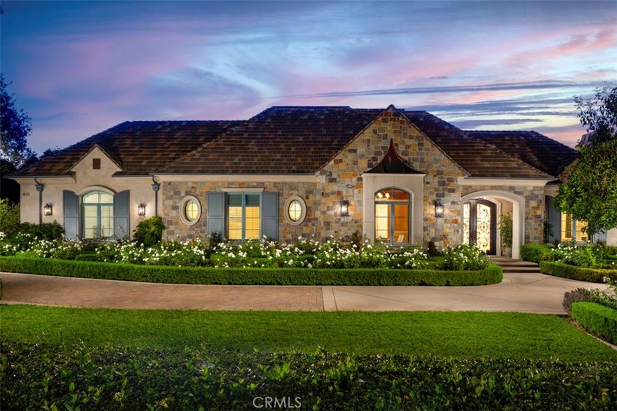 A Rare 10,422-Square-Foot French Estate in Prestigious Santa Anita Oaks,  Set within Arcadia’s esteemed Upper Rancho Area of Arcadia, this extraordinary French-inspired estate presents over 10,000 square feet of rare single-level living on nearly an acre of beautifully landscaped grounds. Designed by the reputable Robert Tong and built by Mur-Sol Construction, this residence embodies timeless elegance, modern luxury, and superior craftsmanship.  Behind its stately façade behind multiple large hedges and gated circular driveway, interiors unfold with grand proportions, soaring ceilings, and exquisite detailing throughout. The magnificent family room, crowned by a Cathedral High coffered ceiling and illuminated by a Gold Czech crystal chandelier, serves as the dramatic centerpiece of the home. Formal living and dining rooms offer refined settings for entertaining, while a richly appointed paneled study, an expansive home theater, and a private fitness room with sauna provide a wealth of lifestyle amenities. Throughout the home, custom designer draperies add sophistication and warmth to every space.  At the heart of the estate, the gourmet kitchen impresses with dual marble-topped islands, professional-grade appliances, and bespoke cabinetry, paired with a fully equipped secondary wok kitchen for seamless entertaining. Six ensuite bedrooms, including a serene and extremely large primary suite with a spa-inspired bath of imported marble and European finishes, provide privacy and comfort for family and guests.  The estate’s outdoor setting is equally remarkable, designed as a private resort retreat. Mature oak trees and lush landscaping frame a vast grassy lawn, an entertainer’s saltwater pool and spa, and an elegant stone terrace with outdoor fireplace. A circular driveway and a four-car attached garage ensure both prestige and convenience, with parking capacity for more than ten additional cars on the grounds. Enhancing the property’s value and efficiency are paid-off solar panels, offering sustainable living without compromise.  Distinguished not only by its scale but also by its rare single-story design, this residence offers a lifestyle of enduring elegance, comfort, and exclusivity—all just moments from Arcadia’s award-winning schools, parks, dining, and cultural destinations.