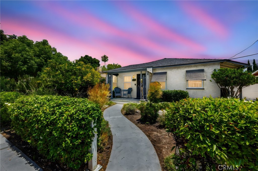 CHARMING, SINGLE-STORY home across from Chapman University and just minutes away from Old Towne Orange. A spacious living room at the entry that has plenty of natural lighting and is adjacent to the dining area which makes it great for entertaining. The kitchen includes cabinetry for storage, gas range, dishwasher, breakfast nook area and direct access to the extended driveway. Main bedroom features spacious bedroom area, direct access to the backyard, ensuite bathroom with walk-in closet. Down the hall is a generously sized bedroom and a full bathroom with shower/tub combo. Large backyard features multiple patio areas, grassy area, and storage. Additional features of the home include a detached two-car garage that is set back from the street with an extended driveway, laundry in garage, newer roof and has a small front porch area. Located just minutes away from Old Town Orange, which includes the historic Central Plaza Park, restaurants, specialty shops, antique stores, and so much more! Only a few minutes away from the Orange Public Library, Orange Farmers Market, and it has easy freeway access. Come view this beautiful house and make it yours today!