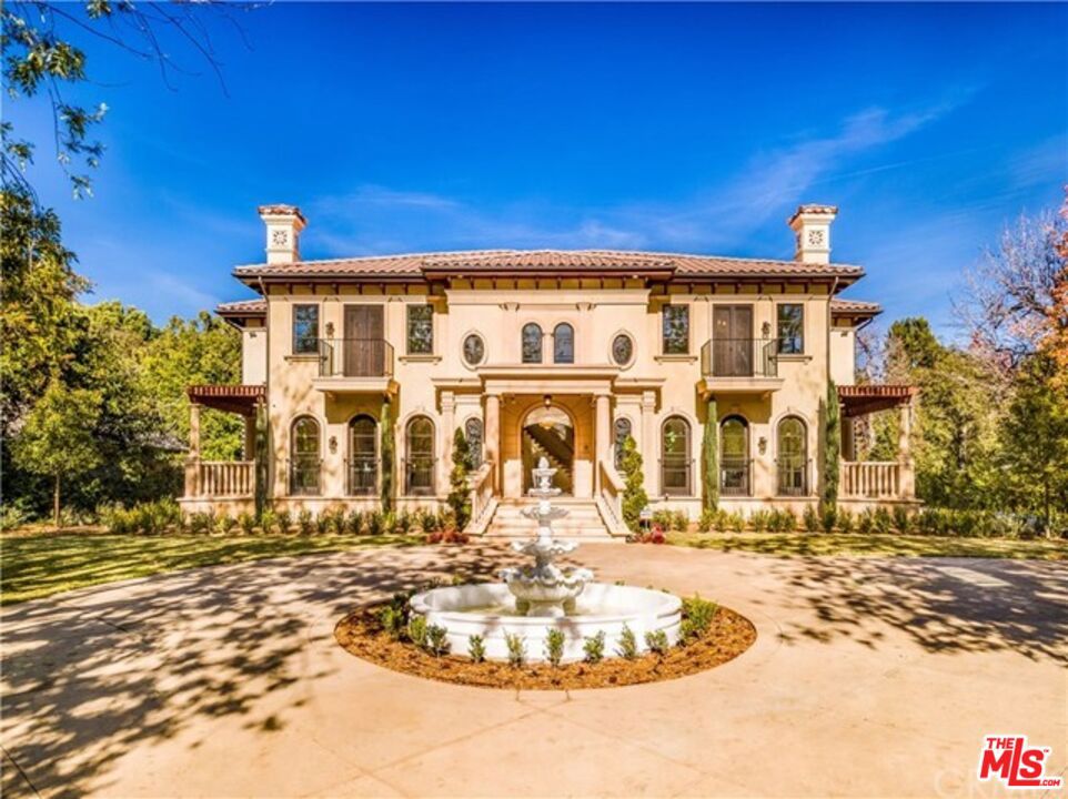 Gated Mediterranean single-family home, located in one of the most desirable and exclusive areas of Pasadena. Sitting on a 33,000+ sqft flat lot, designed by Gustavo Leitenberger and custom built with the finest materials. Captivating formal entryway with soaring ceilings leads to the beautiful curved stairwell. Main level features a formal office/library, formal living room, formal dining room with a wet bar, powder room, theater room, temperature-controlled wine cellar, oversized chefs kitchen with top-of-the-line appliances and a seprate wok kitchen, high ceiling family room with fireplace over looking the backyard, main level master suite with private retreat and lavish bathroom. Take the elevator upstairs will leads you to 4 addional guest suites with garden views, second level master suite with private retreat, magnificent bathroom and a balcony. Outside, resort-like ground features verdant landscaping, beautiful covered pergola and sparkling pool and spa. This property is the crown jewel of the Pasadena Flats!