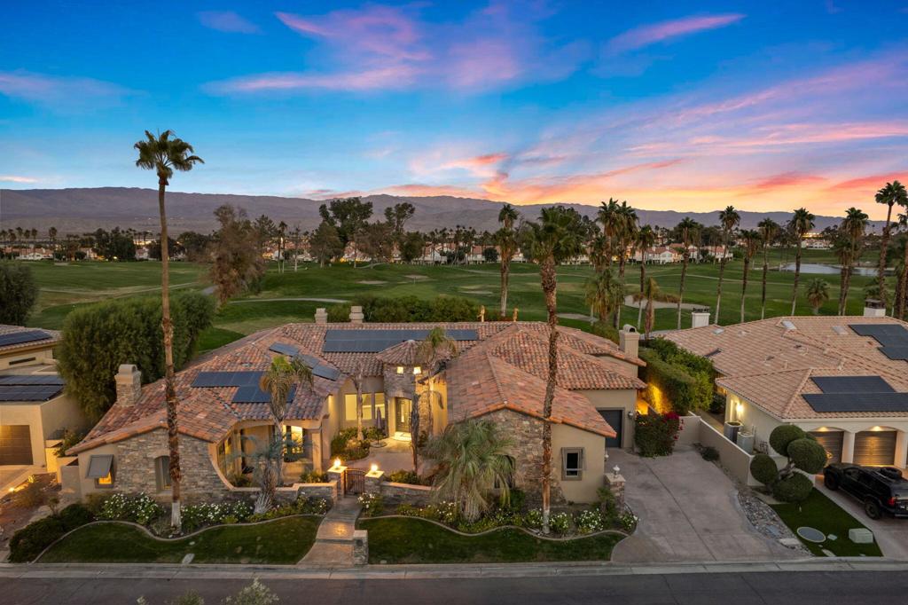 INCREDIBLE VALUE!! SOLAR OWNED!! Custom-built Tuscan estate located in the exclusive Estates at Desert Falls Country Club, a private enclave of only 23 distinguished homes. Spanning over 4,700 square feet, this sophisticated residence is perfectly situated on a unique lot, offering privacy and serene golf course views with stunning mountain backdrops. Nestled behind a second set of gates, this home is a true retreat. The open-concept floor plan boasts soaring 12-14-foot ceilings, inviting natural light into the Great Room and kitchen/family area, complete with a striking granite slab island and a cozy second fireplace. Glass sliders open to a private backyard oasis featuring a sparkling pool, spa, and panoramic views. The luxurious Master Suite is a haven of relaxation, featuring a private seating area, a third fireplace, and an opulent en-suite bathroom with a soaking tub and dual walk-in closets. A separate attached casita, with its own private entrance and fourth fireplace, offers ultimate versatility and privacy for guests or extended family. Additional highlights include a gated front courtyard, a third en-suite bedroom, and meticulous attention to detail throughout. The Estates at Desert Falls offers an unparalleled lifestyle, with country club amenities such as a state-of-the-art health and fitness center, tennis, pickleball, and a championship resort golf course. Welcome home at Desert Falls Estates!