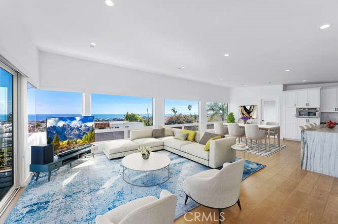 PANORAMIC UNOBSTRUCTED OCEAN VIEWS in this beautifully designed Dana Point beach home! Perfectly perched in one of the area’s most coveted neighborhoods, this coastal gem offers a front-row seat to the Pacific—day in and day out. Rebuilt from the ground up with attention to every detail, this two-story home offers four spacious bedrooms and two-and-a-half bathrooms, all wrapped in coastal elegance and quality craftsmanship. Three bedrooms are downstairs with the living, dining and kitchen areas upstairs to enjoy the views. Also upstairs is a small bedroom well suited to be an office enjoying the ocean views. The kitchen features white shaker cabinets with custom stone countertops and stainless steel appliances. The detached two-car garage and extended driveway add flexibility and function. Designed for effortless indoor-outdoor living, the expansive patio invites you to relax, entertain, and soak up the salty breeze and glowing sunsets. Just minutes from Dana Point Harbor, stunning beaches, top-rated golf, and luxury resorts, this home isn’t just a place to live—it’s a gateway to the ultimate SoCal lifestyle.