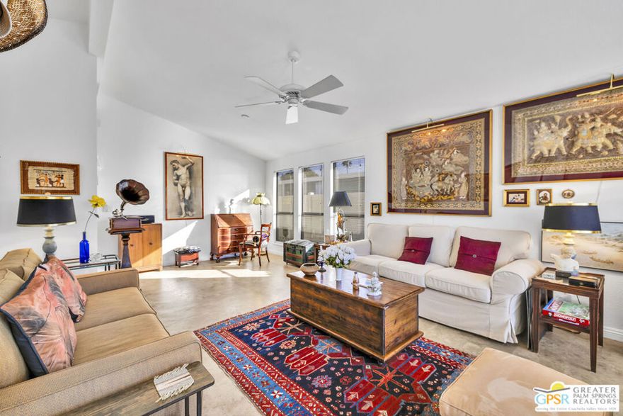 Location + Garage + Solar = A fantastic opportunity at The Canyon, one of the area's most desirable mobile home communities.  This spacious 2 Bed / 2 Bath home with a bonus sunroom offers 1,558 sq. ft. of comfortable, well-maintained living space.  With drywall throughout, recent updates include: new water heater, garage door, and garage insulation (2024) - new kitchen appliances; gas range, refrigerator, microwave, and dishwasher (2020) - new AC coil and furnace (2021) - new AC/heater mini-split in sunroom, new electrical panel, and patio misting system (2019).  From the cozy living room, take in the mountain views and gorgeous desert sunsets.  The kitchen features granite tile countertops and custom cabinetry. The large primary bedroom with ensuite bath creates a private retreat within the home. The primary and guest baths both offer granite countertops and custom cabinetry, with the primary bath featuring dual sinks. The bonus sunroom offers versatile possibilities and features a gas fireplace.  Energy efficiency is a highlight with 20 leased solar panels installed in 2020 by Sunrun, and a vented evaporative cooler, helping keep energy bills low.  Enjoy the convenience of the laundry room adjacent to the attached two-car garage.  Outside, the private, fenced backyard includes an electric patio awning and two mature citrus trees. Community amenities at The Canyon include two sparkling heated pools and spas, tennis & pickleball courts, a welcoming clubhouse with library/card room, billiard/game room, fitness room, crafts room, indoor shuffleboard, and a beautiful multi-function room with a stage and professional-style kitchen, ideal for events. This home is conveniently located on a quiet street, just one block away from the clubhouse.  The Canyon is a gated, well-maintained 55+ community. Buyers must obtain park approval, which requires a minimum 750 credit score and proof of income three times the monthly space rent of $995. One pet up to 20 lbs is permitted. Buyers and their agents to verify current space rent and square footage. With PSP Airport, shopping, and restaurants just minutes away, this home is perfect for year-round living or as a vacation retreat.