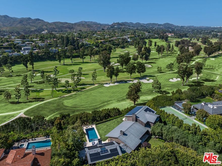 A true sanctuary in every sense, this one-of-a-kind trophy estate by the late, legendary architect Howard Backen sits on the 7th hole of the iconic Riviera Country Club - the only Backen-designed home ever built on L.A.'s premier golf course. Encompassing approximately 12,240 SF, this 6-bedroom, 6-bathroom masterpiece captures sweeping views of the Santa Monica Mountains with some of the most breathtaking sunsets in the city. Backen, renowned for shaping modern California architecture, was a visionary of elegant simplicity, expressive natural materials, and seamless indoor-outdoor living. This home stands as a living tribute to his legacy - crafted with board-formed concrete, vaulted wood ceilings, steel-frame windows, and disappearing glass walls that dissolve the boundary between architecture and nature. Designed to elevate every moment, the estate features a massive motor court, a chef's kitchen, temperature-controlled wine cellar, movie theater, guest house, spa and wellness center, dedicated kids' lounge, and the most iconic man cave ever imagined. Fully powered by geothermal energy, this compound offers off-the-grid living without sacrificing a single luxury. This private retreat sits tucked away on what may be L.A.'s best-kept secret street. The location is unparalleled: discreetly positioned next to Channel Road, it offers quick access to the beaches, Malibu, the Brentwood Country Mart, and some of the finest dining - all while feeling worlds away from it all. Welcome to ground zero for luxury, privacy, and sophisticated Zen living.