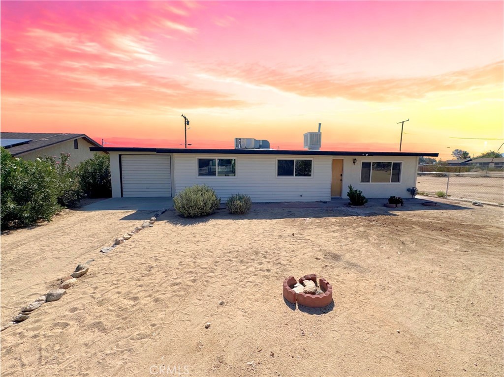 Welcome to this move-in ready, single-story gem, ideally located in the heart of Twentynine Palms! This beautifully remodeled 3-bedroom, 1-bath home offers 1,056 sq. ft. of modern living space and sits on a spacious lot with both front and backyard ready to be landscaped into your personal desert oasis.
Step inside to discover brand-new waterproof laminate flooring throughout, recessed lighting in every room, and a fresh coat of paint inside and out. The stunning kitchen is a true showstopper—featuring sleek quartz countertops, crisp white shaker cabinets, stainless steel appliances, and contemporary finishes designed with both style and function in mind.
The fully renovated bathroom exudes luxury with marble-look tile on the floors and shower walls, a rain-style shower head, modern vanity with quartz countertop, and matte black fixtures that tie it all together. Natural light pours in through a large window, making the space feel bright and refreshing.
Every detail has been thoughtfully upgraded, including a new water heater, new closet doors in each bedroom, all-new underground piping, dual-pane energy-efficient windows, and a roof replaced just five years ago for added peace of mind.
The attached garage offers even more value, featuring a dedicated workshop area with a tool wall—perfect for hobbyists, DIYers, or extra storage and functionality.
Enjoy your morning coffee or entertain guests under the covered back patio, with ample outdoor space ready for your vision—add a garden, outdoor lounge, or even a fire pit.
Located just minutes from the entrance to Joshua Tree National Park, this home offers quick access to scenic hiking, world-class rock climbing, and stargazing. Enjoy nearby local shops, restaurants, art galleries, and community events in Twentynine Palms' charming downtown. Plus, it’s conveniently close to the Marine Corps base, schools, and everyday amenities — the perfect blend of nature, culture, and convenience.