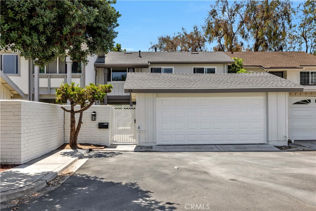 Charming Mid-Century home in University Park located on an interior lot with open grassy area in the back. North facing. A rare opportunity to find a highly upgraded home in University Park. A private gated courtyard entry with plenty of room to relax and play. No neighbor in the back and at the front. It means you have an unobstructed, peaceful view of the park and sunset. Inside, the home's classic mid-century architecture shines with floor-to-ceiling glass windows, a beautiful floating staircase, and an oversized kitchen with multiple dining areas. Sliding glass doors open to your backyard, with direct access to scenic walking paths that lead to an array of community amenities. Downstairs: A living room and family room with view of the greenbelt, formal dining, breakfast nook, a powder room bath and a remodeled kitchen with stainless appliances, granite countertops and white cabinetry. Upstairs: A large primary suite with floor-to-ceiling glass windows, seating area with fireplace, remodeled bathroom with oversized shower and tub, 3 additional bedrooms, and another full bath. Luxury travertine floors and hardwood floors on the first level, carpets on the upper level. A full wall of storage cabinets for your family needs. BRAND NEW roof, BRAND NEW LED recessed lights, BRAND NEW interior and exterior paint. BRAND NEW roller shades for the glass windows. The garage has been upgraded with BRAND NEW drywalls and insulation. NEWER HVAC system, water heater and double-paned windows. The home is part of the Irvine Unified School District, known for its highly rated schools, including University High School. The property is centrally located with access to Village Park’s resort-style amenities, including pools, spas, tennis courts, volleyball courts, pickleball courts, a clubhouse, and 44 acres of scenic greenbelts and walking paths. It’s within walking distance to University Park Elementary, Rancho San Joaquin Middle School, and shopping centers, with easy access to major freeways and the University of California, Irvine (UCI). Clean property for immediately move in!