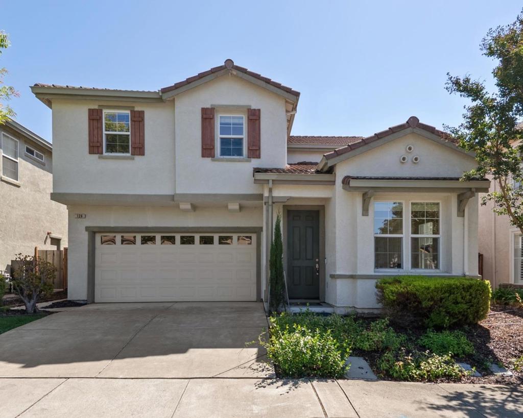 Situated on a quiet, tree-lined street and thoughtfully tucked away from the daily hustle and bustle, this beautifully maintained home offers the perfect blend of space, comfort, and convenience. Featuring 5 bedrooms, 3 full bathrooms, and a study area, this residence spans an impressive 2,649 sq. ft. of living space, designed to accommodate families of all sizes. The inviting floor plan begins with a formal living room and dining area, ideal for hosting gatherings and creating cherished memories. The heart of the home is the kitchen and family room combination, offering a warm and open setting perfect for both everyday living and entertaining. A sought-after feature is the bedroom and full bathroom on the main level, providing flexibility for guests, in-laws, or multigenerational living. Upstairs, the home continues to impress with generously sized bedrooms, including a comfortable master suite that serves as a private retreat with ample space for relaxation. Recent updates enhance the homes appeal, including fresh interior paint that brightens each room and new carpet in the upstairs bedrooms, creating a clean and welcoming atmosphere. The well-kept condition of the property highlights the pride of ownership and makes it move-in ready.