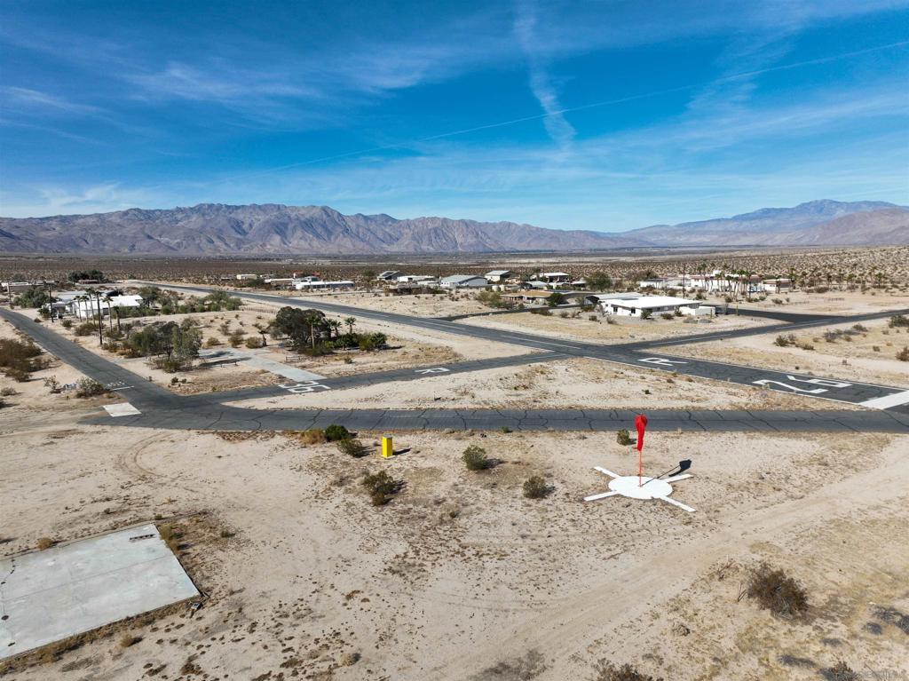 Two adjacent lots in the private Borrego Air Ranch with water rights for two houses. Has perimeter split rail fencing, piping & irrigation. Several palm, olive & fruit trees. Lot 20 is elevated. There is an existing slab where the portable hanger used to be. This is a well maintained and registered airport with landing runways and taxi-ways. Located on the Southwest corner of the Borrego Air Ranch with no one across the street. This is a perfect place to build your dream aviation home!