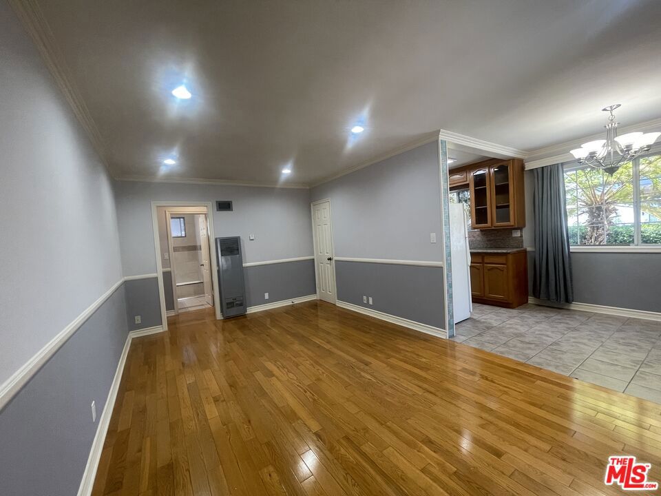 This spacious 1-bedroom, 1-bathroom apartment offers approximately 650 sqaure feet of comfortable living space. Situated on the lower floor of a well-maintained 8-unit building, this unit provides a quiet retreat while being just moments away from the vibrant attractions of West Hollywood. The unit features a generous living area with hardwood floors throughout, creating a warm and inviting atmosphere. The kitchen comes equipped with essential appliances, including a range/oven, refrigerator, and garbage disposal. The comfortable bedroom boasts a separate air condition unit, and large closet. The bathroom is clean and functional with contemporary fixtures. Water and trash costs are included in the rent. 1 parking space is available for an additional fee. With a Walk Score of 95, the property is within walking distance to popular shops, cafes, and restaurants, including Target, Trader Joe's, Sprouts, and Starbucks. Public transportation is easily accessible, providing quick access to the rest of Los Angeles.