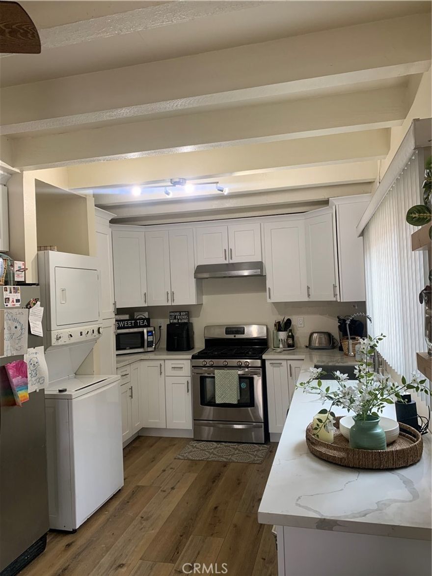 Welcome to this spacious and modern condo featuring a beautifully remodeled kitchen with sleek countertops, stainless steel appliances, and ample cabinet space — perfect for cooking and entertaining. The home offers new flooring throughout and tastefully updated bathrooms with contemporary finishes for a fresh, luxurious feel.

Enjoy a comfortable open layout with plenty of natural light and room to relax. The community offers fantastic amenities, including a sparkling swimming pool, a clubhouse/gathering room for social events, and well-maintained common areas that make every day feel like a getaway.

Move-in ready and conveniently located — this condo combines comfort, style, and community living at its best.