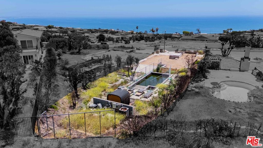 Located in Sunset Mesa, this oversized 9,310 SQ FT lot on Clifftop Way offers rare privacy with no homes behind it and unobstructed coastal and mountain views. It's one of the most desirable parcels in the neighborhood --- perched on the view side of the street, with long-term protection of your sightlines already built into the CC&Rs. The property offers a rare opportunity to fast-track your rebuild and create a brand-new coastal retreat with sweeping ocean and mountain views. Plans for a 3,599 SQ FT modern home have already been approved by Building & Safety and are ready to proceed with the Fire Rebuild application with Regional Planning. Buyer has the ability to add a further 10% to these plans as part of the 110% like-for-like rebuild. Phase 1 and Phase 2 environmental clearances are complete, and architectural plans are available upon request. Buyers can either build independently or partner with the Sunset Mesa Collective --- the experienced design/build group behind the rendering --- who can customize the plans and manage the full development process. With approvals in hand and all key prep work done, the path to construction is clear and well underway. Whether you're an investor seeking a streamlined project or an end-user ready to build a custom ocean-view home, this lot delivers flexibility, momentum, and long-term upside. Be part of Sunset Mesa's next chapter --- a community rebuilding stronger and more resilient than ever. This is a land listing only.