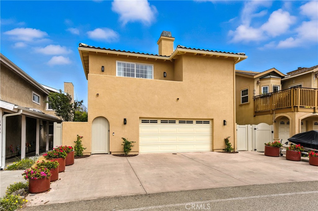 Location, location, location! Just steps from pristine beaches and the sparkling Pacific, 4931 Shoreline Way is a beautiful home in the heart of the coveted Mandalay Bay community—where sandy strolls, harbor dining, and breathtaking sunsets are part of everyday life. Enjoy easy access to the Channel Islands Harbor farmers’ market, yoga at Oxnard Beach Park, and endless water activities, all while savoring cool ocean breezes and the best of Ventura County coastal living. Built in 1995, this 3,124 sq ft residence on a 5,227 sq ft lot is newer than most in the area and features a rare, versatile layout. Two bedrooms upstairs and two downstairs are complemented by living rooms on both levels, perfect for guests or multi-generational living. High ceilings and abundant windows fill the home with natural light, while three balconies—two off the primary suite and one off the upstairs living room—capture fresh breezes and neighborhood views. Outdoor living shines with a private courtyard between the home and garage, plus a grassy backyard with a patio. The large open kitchen offers extensive cabinetry, a built-in writing desk, and a sunny breakfast area, along with a formal dining room. Fireplaces in the upstairs living room, downstairs living room, and primary bedroom add warmth and charm. The spacious primary suite features a walk-in closet, standalone shower, spa tub, and two private balconies. Freshly painted inside and out with a brand-new vinyl fence for beauty and privacy, the home also includes a two-car garage plus two additional parking spaces in the driveway—an exceptional advantage near the beach. Just a block away, ’ololkoy Beach Park—formerly known as Oxnard Beach Park—offers 62 acres of oceanfront beauty with rolling grassy lawns, picnic and barbecue areas, walking and bike paths, playgrounds, volleyball courts, and breathtaking views through the coastal dunes to the Channel Islands National Park. Distinctive in both design and age, this property combines beauty, comfort, and location, making it a truly special coastal opportunity.