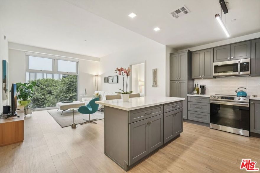 This bright and beautifully updated 2-bedroom, 2-bath home offers an inviting blend of modern finishes and downtown energy.  Floor-to-ceiling windows in every room fill the space with natural light, highlighting the open layout with wide-plank floors, lofty ceilings, and a brand-new HVAC system with Nest thermostat for year-round comfort. The kitchen features dark gray cabinetry, quartz countertops, a full-height backsplash, pull-out drawers, and stainless-steel appliances, perfect for cooking or casual entertaining. Both private bedrooms sit on opposite sides of the living area for added privacy, each with charming bay windows ideal for reading, relaxing, or working from home. Bathrooms are sleek and refreshed with a soothing, modern aesthetic. Additional perks include an in-unit washer/dryer, custom window shades, and one reserved parking space. Library Court offers residents secure access, a fitness center, an open-air bamboo courtyard, and professional management. Located in DTLA's Financial District, you'll be steps from the Central Library, The Bloc, Bottega Louie, Metro stations, and a dynamic mix of cafes, dining, and night life, everything you need for connected city living. ***Some utilities and 1 parking space included.***