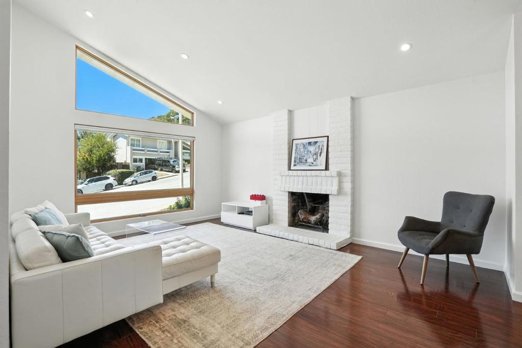 This partially furnished split-level residence offers 4 bedrooms, 2.5 bathrooms, and sits on nearly 15,000 sq ft of land, providing plenty of space for comfortable living. Designed with vaulted ceilings and an open concept layout, the home feels open, airy, and inviting from the moment you step inside. The spacious family room creates a warm and cozy atmosphere and opens directly to the private backyard, where youll find a sparkling pool and hot tub, perfect for both relaxation and entertaining. The updated kitchen features stainless steel appliances and an adjoining breakfast room that leads to the backyard patio, making it easy to enjoy indoor-outdoor dining. The home is complete with beautiful laminate flooring throughout, tastefully updated bathrooms, and a dedicated laundry room for convenience. A finished garage offers additional flexibility for parking or storage. Conveniently located near Edgewood Road with quick access to Highway 280, this home combines comfort, style, and an unbeatable location.