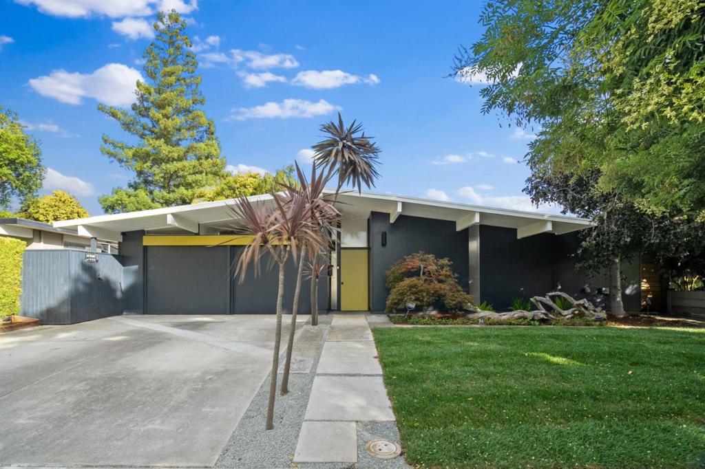 Tranquility extends throughout this Fairglen neighborhood Eichler home. The open air atrium centers around an epic koi pond with several 15+ year old koi fish, and water feature that instantly creates a soothing ambiance. The atrium provides multiple access points into the home creating flexibility and flow. The bright living & dining space features classic post and beam construction with pitched roofline, marble floors and gas fireplace. Floor to ceiling panels of glass provide views into the backyard where you'll find a black bottom pool & spa, built-in seating, outdoor fireplace and bar. The open concept kitchen features granite counters, stainless appliances, wood cabinets with lots of storage, breakfast bar plus spacious eating area. Separate laundry and pantry room off the kitchen, with a door to the side yard. The converted garage is currently offered as a bonus room, but can be converted back if desired. The primary bedroom has its own access to the backyard via European double pane tilt/swing glass doors and updated bath. Central forced air heating and updated 200amp electrical panel. Booksin Elementary. Idyllic location walk to Doerr Park with tennis & pickleball courts, basketball court, baseball field, playground and picnic areas, as well as popular Park Wilshire Pool