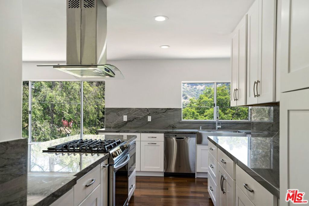 Contemporary! Just minutes to the Heart of Beverly Hills, Beverly Hills Hotel, World-renowned shopping and famous dining. Nestled on a quiet- cul-de-sac street. Tremendous natural light exposure, each room offers beautiful canyon and city light views. Open floor plan makes it perfect for entertaining. High ceilings, recessed lighting and gleaming walnut hardwood floors throughout. Kitchen boasts new cabinets, quartzite countertops and new appliances. Retreat to a serene primary suite with fireplace, walk-in-closet, elegant master bath. Private back patio for al fresco dining or simply to relax and enjoy nature. Guest/Maid's room on the main level.