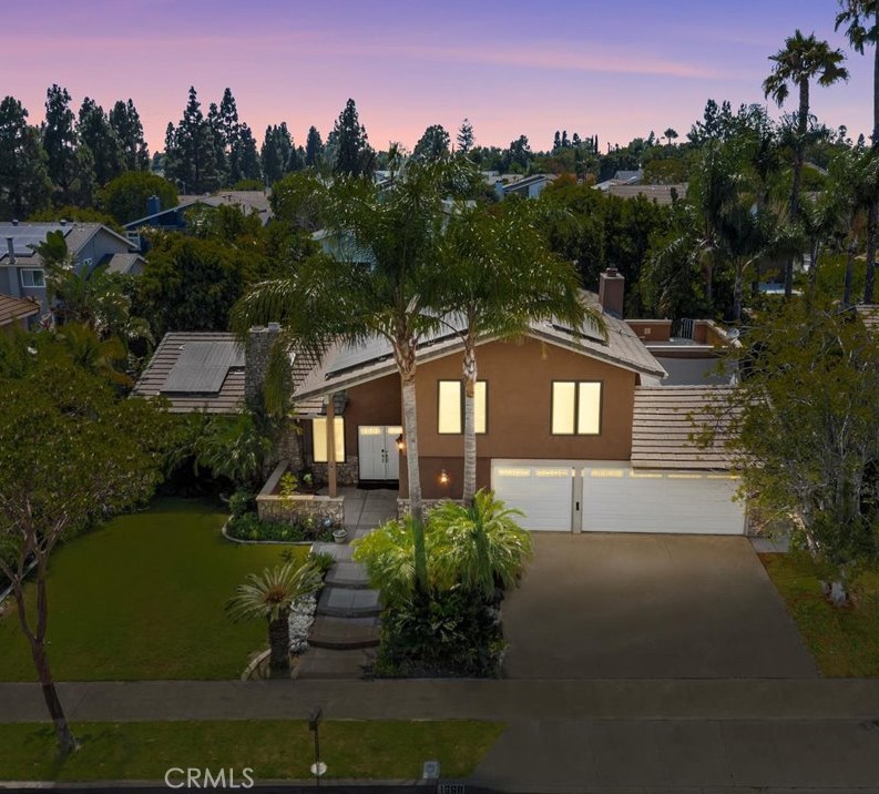 Bordering Villa Park, this pool home oasis offers pure California outdoor & indoor living!
This beautifully upgraded 3-bedroom pool home with a large bonus/media room that can serve as a guest room, office, or playroom offers space, versatility, and comfort. Peacefully positioned in one of the area’s most desirable neighborhoods near Villa Park, with no HOA and your own private oasis. Inside, you’ll find vaulted cathedral ceilings with skylights, crown molding, plantation shutters in every room, warm laminate wood floors, recessed lighting, and ceiling fans in every bedroom. The bright living and dining areas flow into an updated kitchen with Travertine tile, granite counters, stainless appliances, and a sunny bay window that looks out over the pool and lush, tree-lined backyard (including mature avocado & lemon). A few steps down, the cozy family room offers a second fireplace, wet bar, and double French doors that open to your private backyard retreat. Another set of French doors leads into the large bonus/media room with built-ins, perfect for movie nights, a home office, or extra guest space. Upstairs, you’ll find three bedrooms and two remodeled bathrooms. The primary suite features a tiled walk-in shower with a glass enclosure, a walk-in closet, and an expansive private terrace (virtually stagged for size comparison) with sunset and pool views. The second bathroom includes a tiled shower and tub combination with a glass enclosure. A spiral staircase connects the terrace to the newly redone sun-decked patio (September 2024) and inviting in-ground gas fire pit below. Tall, mature trees surround the backyard, providing total privacy while you swim in your sparkling pool.
Additional upgrades and smart home features include Z-Wave integration, CAT 6 wiring, electrical wiring and panels replaced, smart thermostats, indoor and outdoor smart lighting, Rachio weather-controlled sprinklers, a Ring video doorbell, a whole-house fan, a water filtration system, Net Zero leased solar (46 panels in total), a dedicated electrical panel for a generator installed in 2025, and the tile roof and dual-pane windows replaced in 2013.
Located within the highly regarded Villa Park school district and just minutes from scenic hiking trails, local restaurants, and everyday shopping.
LG front loading Washer & dryer, stainless fridge, all steel garage shelving, and all smart systems stay with the home. Simply move in, enjoy, and make the home yours.