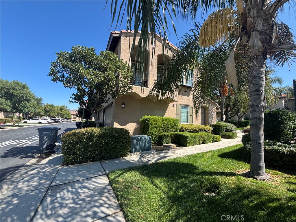 Two-story condo within a gated, amenity-rich community in Perris. Featuring 3 bedrooms (including one on the main level), 2.5 baths, a modern kitchen with quartz counters, a private gated patio, and a cozy living room with fireplace, it merges comfort with functionality. Two-car garage plus additional parking, central HVAC, and HOA-managed maintenance including security, it's a turnkey property within a sought-after complex.