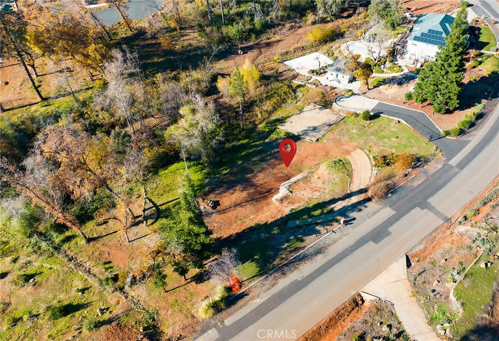 Your chance to build in Paradise! Discover this 1.16-acre lot tucked away in one of Paradise’s most desirable neighborhoods. With a seasonal creek meandering through the back, and plenty of space to spread out, this property offers a peaceful setting for your future home. The lot previously held a 3,000 sq. ft. residence, and with CC&Rs requiring a minimum of 1,600 sq. ft., you’ll have the flexibility to design a home that fits both your lifestyle and the natural surroundings. Whether you envision a modern retreat or a classic craftsman, this lot provides the perfect canvas. Enjoy the convenience of being just minutes from Lime Saddle Marina—perfect for weekends spent on the lake with boating, fishing, and water recreation right at your fingertips. This property is an excellent opportunity to secure a piece of Paradise at a value you won’t want to miss.