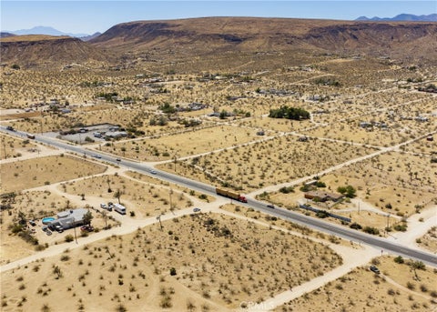 Photo of 141 Old Woman Springs Road, Yucca Valley, CA 92285 (MLS # JT26201367)