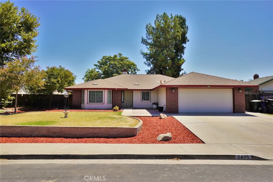 Nestled in a North Hanford neighborhood, on a culdesac this well maintained home with 1,973 s/f  of comfortable living space on an impressive 11,180 sq ft lot is ready for a new owner.  With 3 bedrooms and 2 bathrooms, this home blends functionality with warm character throughout. Step into the formal living room, complete with built-in features perfect for displaying books, art, or keepsakes. The large kitchen offers plenty of counter space, a breakfast bar, and a cozy nook ideal for morning coffee. Adjacent to the kitchen is a versatile dining/den area, featuring a wood-burning stove set on a classic brick platform—perfect for chilly winter days. Tiled floors flow throughout the home for easy maintenance, with cozy carpet in the bedrooms for added comfort. Outdoors, enjoy a wrap around covered patio with BBQ area, a playset for the kids, raised garden beds for your green thumb, and a handy storage shed—all within your private, oversized backyard.  Schedule a tour today!