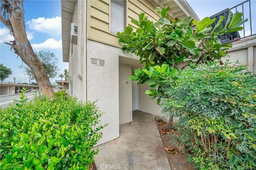 Perfect 2-bedroom, 2-bathroom starter home in the heart of Orange County. This ground-level end-unit condo is located in the Villa Vallerto community. The kitchen features quartz countertops and ample cabinet space. A sliding glass door off the living room opens to a backyard space, bringing in natural light and offering additional outdoor space. The seller has also upgraded some windows recently. The condo includes one covered, detached carport space. Villa Vallerto offers amenities such as a swimming pool, clubhouse, playground, and laundry facilities. The community’s convenient location provides easy access to the 55 and 5 freeways, park, and nearby shopping and dining. This condo blends comfort, convenience, and value in a desirable Tustin location.