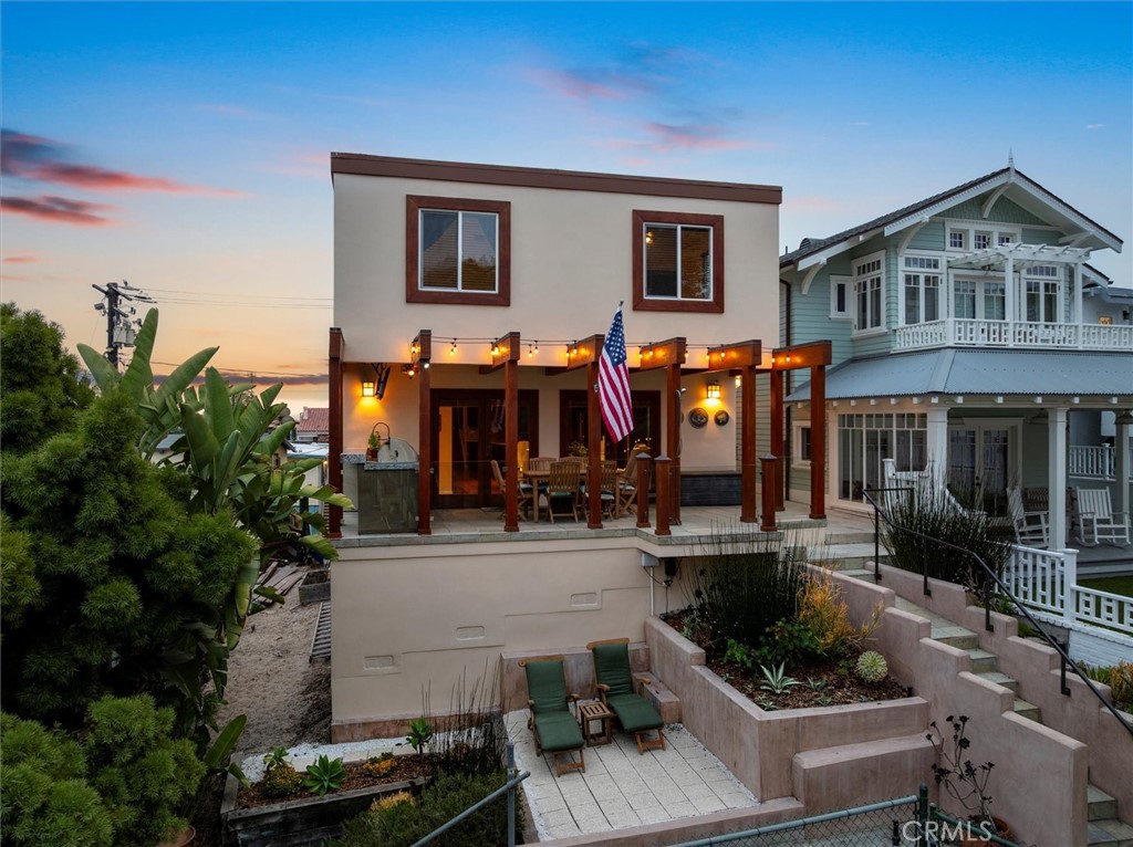 Looking for a house with an attached guest house? You found it! Welcome to 408 17th St an exceptional walk-street gem nestled just steps from the ocean, downtown Manhattan Beach and the beloved Live Oak Park. Perfectly perched, this spacious, and fully furnished, walk-street home overlooks Live Oak Park and offers the ultimate in California coastal living. On the weekend, trade in your car for your beach cruiser and flip flops. Everything is that close! The main home has 4 bedrooms and 4 bathrooms and an open floor plan that is light bright and drenched in sunlight. The large Master suite features a spa like bath with radiant heated marble floors and a cedar-lined walk-in closet with built-ins. There is also an attached spacious private guest unit (1BR / 1BA) with a full kitchen, living room, laundry room and separate entrance. This unique property features an open floor plan that flows seamlessly onto a large deck with outdoor kitchen, a Lynx gas grill, Traeger smoker, pizza oven, granite countertop, sink and an outdoor TV with remote-controlled motorized mount. The gourmet chef's kitchen has a 48" Sub-Zero fridge, Bosch dishwasher, a 48" Wolf range with dual ovens, Viking hood and 2 stainless steel sinks. Looking to entertain? You will love the game room accentuated by a beautiful poker/pool/ping-pong table, shuffleboard, foosball and redwood bar with kegerator. The 2-car garage has an EV charger and a Tesla Powerwall for backup/emergency power. For the techies, there is Frontier FioS Wifi (500MB/s) and a preconfigured Eero mesh network. Hurry, this will not last!!!