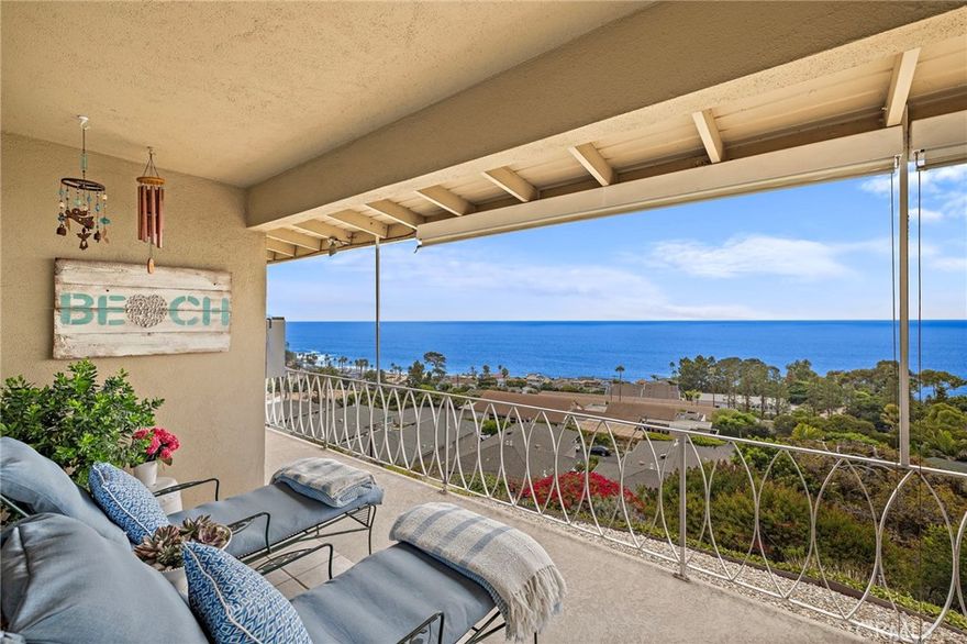 Perched above the famed Montage Resort in one of Laguna Beach’s most desirable coastal locales, this two bedroom, one bathroom condo offers  stunning panoramic ocean views and a relaxed coastal lifestyle. From the kitchen, dining area, living room, and veranda, enjoy sweeping, unobstructed vistas of Catalina, Aliso Creek, and whitewater surf, along with vibrant sunsets and city light views that stretch up the coast toward Rancho Palos Verdes. Inside, the kitchen features frosted glass cabinetry, Caesarstone countertops, a custom Julian cedar dining bar, stainless steel appliances, and hardwood flooring. A cozy dining nook is positioned to make the most of the view, while the open concept living space brings in tons of natural light and creates a seamless flow for everyday living or entertaining. Glass sliders lead to a spacious veranda outfitted with remote-controlled shades, designed to filter sun without compromising the view. Central air conditioning adds comfort on warm summer days. The bathroom is thoughtfully designed with Italian cabinetry, Philippe Starck fixtures, dual vessel sinks, a walk-in glass shower, standalone soaking tub, heated towel rack, and two skylights for natural light. The primary bedroom includes a walk-in closet, while the second bedroom offers a mirrored closet and French doors that open to the living room and capture ocean views when open. Additional highlights include double-paned windows throughout, a private one-car garage, fresh interior paint, and access to a year-round heated community pool. This home offers the perfect opportunity for a full time residence, second home, or investment in one of Southern California's most sought after communities, just moments from renowned beaches, galleries, restaurants, hiking trails, and more!