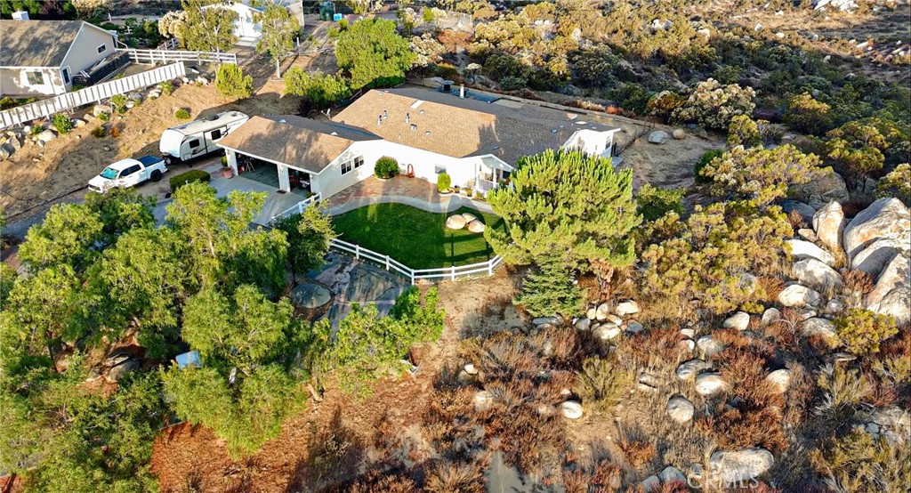 Welcome to your peaceful retreat in the desirable Lake Riverside Estates community of Aguanga, CA. This well-maintained Cavco manufactured home, built in 2004, offers 3 spacious bedrooms, 2 full bathrooms, and sits on a generous 3.57-acre lot with breathtaking panoramic views of the surrounding hills and countryside.
Step inside to an inviting, open floor plan filled with natural light. The living area flows seamlessly into a functional kitchen and dining space—perfect for family living or entertaining guests. Enjoy quiet mornings and spectacular sunsets from your private yard or take in the scenic beauty of the natural landscape around you.
Located in a gated equestrian-friendly community, Lake Riverside Estates offers residents access to a private airstrip, community pool, lake, trails, and more—all just a short drive from Temecula wine country.
Whether you’re looking for a full-time residence, weekend getaway, or investment opportunity, this property combines comfort, space, and tranquility.
Don’t miss your chance to own a slice of rural paradise!