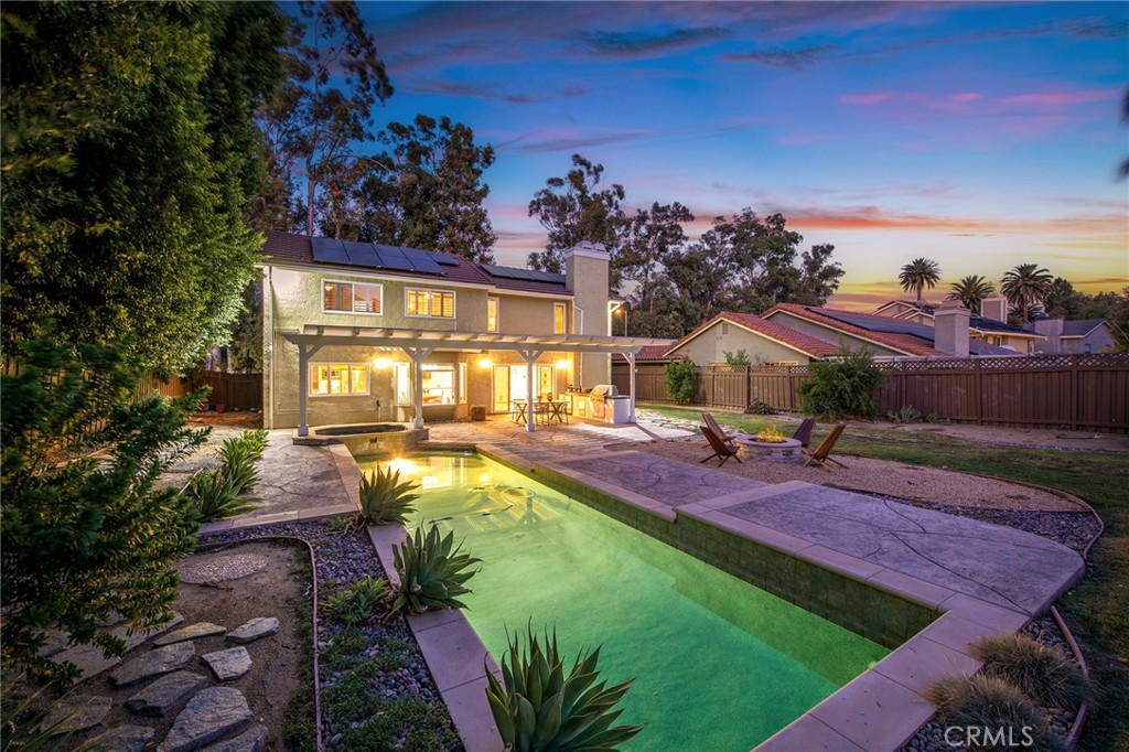 TO SEE VIDEO VIRTUAL TOUR: If you do not see a video icon or link, copy and paste address into search field of YouTube.com.
Just steps from the historic Orcutt Ranch Horticultural Center and Community Garden, 8127 March Avenue is a beautifully upgraded two-story home nestled in a peaceful, family-friendly neighborhood with no neighbors across the street and access to top-rated schools. The Ranch offers seasonal rose gardens, fruit orchards, nature trails, creeks, a 700-year-old oak tree, a rustic barn, courtyard, and gazebo. Step inside to soaring 20-foot ceilings in the living room, accented by a striking chevron wall and real wide-plank hardwood floors. The gourmet kitchen features beautiful travertine flooring, custom wood cabinetry, a walk-in pantry, and two high end ovens. The kitchen seamlessly flows to a cozy dining nook with booth seating and a bay window. The massive primary suite is a truly unique, showcasing a private sitting area with its own fireplace, dual walk-in closets, and a luxurious spa-inspired bathroom complete with dual sinks, a dedicated makeup vanity, private toilet room, and a sunken walk-in shower under a glass ceiling. Outdoor living is equally impressive with a resort-style backyard featuring a sparkling pebble tec pool and jacuzzi, a gas fire pit, and an expansive stamped concrete patio under a wood pergola. The built-in outdoor kitchen includes a built in barbecue grill, refrigerator, and stone countertops. Amazingly, this home also includes a fully paid solar system, a spacious 3-car garage, and is zoned for highly rated schools. Just a 10 minute walk to Justice Elementary (10/10), and a short drive to El Camino High, Hale Middle School, and Chaminade private high school. Also, just a four minute walk to what could be a family weekend gathering spot at a strip mall that includes a bakery, an Italian restaurant, and a gym. Don’t miss this rare opportunity to own a show-stopping home that blends luxurious interior features with an entertainer’s paradise outdoors!