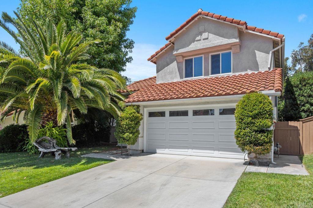 Welcome to The Cove, a sought-after gated community in the heart of Shadowridge and just 10 minutes from the beach! This charming three bedroom, three bath home has the perfect mix of comfort and style, starting with soaring vaulted ceilings and skylights that fill the living and dining areas with warm natural light. The brand-new gourmet kitchen is a true highlight, featuring quartz countertops, apron front sink, stainless steel appliances, and modern finishes. The kitchen opens into the family room, where a cozy fireplace creates the perfect gathering space. New luxury vinyl plank flooring runs throughout the downstairs, while upstairs the spacious primary suite offers vaulted ceilings and a private en-suite bath with dual sinks. Two additional bedrooms and a full bath complete the upper level. Smart upgrades include solar, an EV charger and brand-new dual pane windows for year-round efficiency. Outside, a peaceful wooded backyard with mature trees offers a quiet place to relax or entertain. As a resident of The Cove, you’ll enjoy the sparkling community pool, plus all that Shadowridge has to offer—parks, trails, shopping and golf just minutes away. Your Shadowridge retreat awaits!