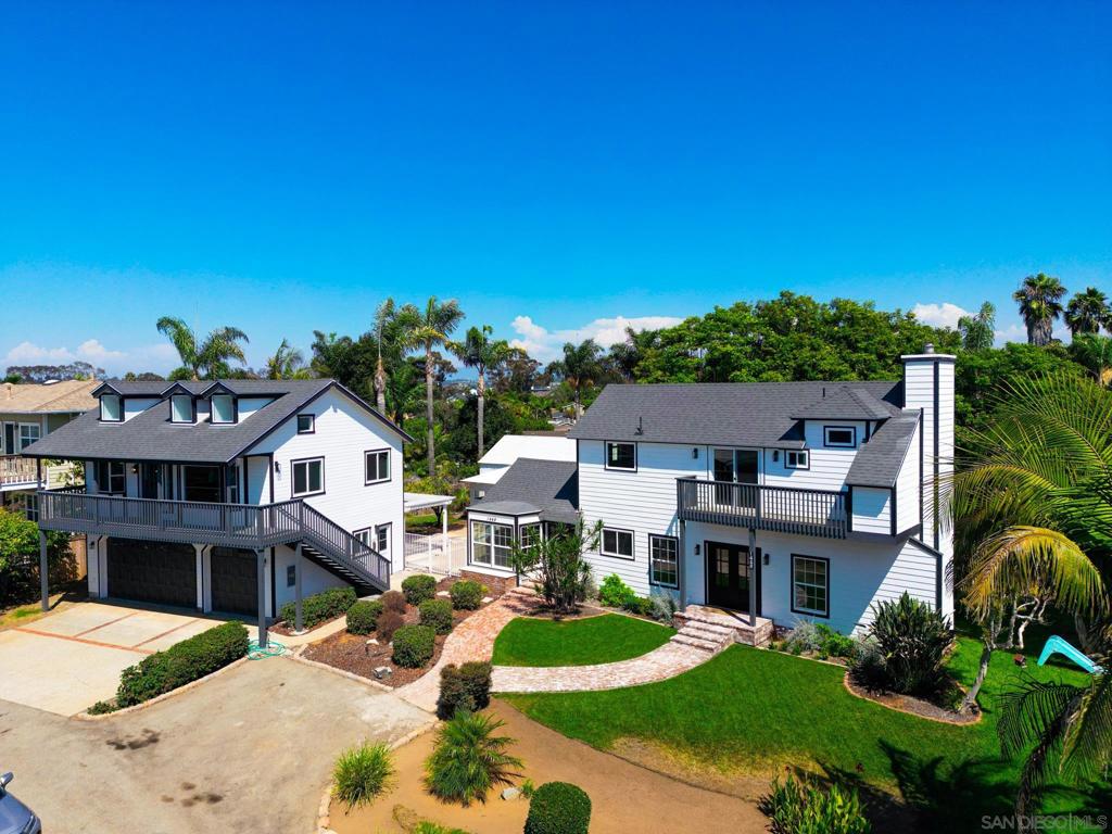 Coastal Living in Olde Carlsbad – Ocean Views & Versatile ADU! Welcome to 1448 Forest Avenue, where timeless coastal charm meets modern luxury. Perfectly positioned in the heart of Olde Carlsbad, this beautifully updated home offers sweeping ocean views and endless lifestyle possibilities—all just minutes from the beach. The main residence features 4 bedrooms and 3.5 bathrooms, including a downstairs bedroom currently used as a home office. At the center of the home is a gourmet kitchen designed to impress, complete with a 10-foot island, custom cabinetry, hidden pantry, and top-of-the-line appliances. Seamless flow connects the kitchen to the formal dining room, living area with fireplace, and inviting outdoor spaces—ideal for both everyday living and entertaining. Upstairs, the primary suite is a true retreat with a private ocean-view deck, spa-inspired bathroom with clawfoot tub, and a spacious walk-in closet. Adding to the home’s appeal is a fully detached ADU above the 3-car garage. With high ceilings, abundant natural light, one bedroom, one full bath, and a private deck, this guest house is perfect for extended family, visitors, or rental income. The 3-car garage also includes a bonus full bathroom for extra convenience. Situated on a generous lot, this property offers room to explore future possibilities while enjoying the unbeatable location near Carlsbad’s beaches, shops, restaurants, and top-rated schools. This is more than a home—it’s a coastal lifestyle opportunity you won’t want to miss.