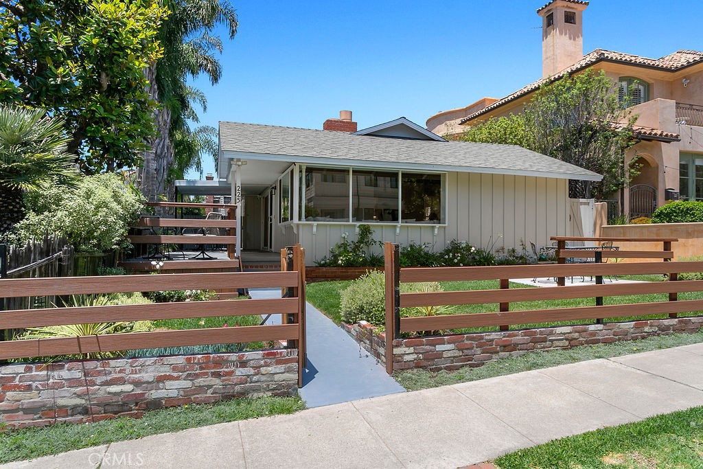 Just one block from the ocean and located on one of the most desirable streets in Corona del Mar Village, this beautifully remodeled and fully furnished beach cottage offers a perfect blend of coastal charm and modern luxury. The home features 3 spacious bedrooms, 2 stylish bathrooms, and an open-concept layout designed for effortless entertaining. High-end finishes include detailed herringbone hardwood flooring and premium appliances—such as a Wolf range, Sub-Zero refrigerator, and more. Outdoor living is just as inviting, with both a front yard and a private backyard, complete with patio seating ideal for dining al fresco or relaxing in the ocean breeze. Rare for the Village, the property also offers parking for up to three cars. Whether you're seeking a full-time coastal residence or a turnkey beach retreat, this exceptional home is ready to be enjoyed.