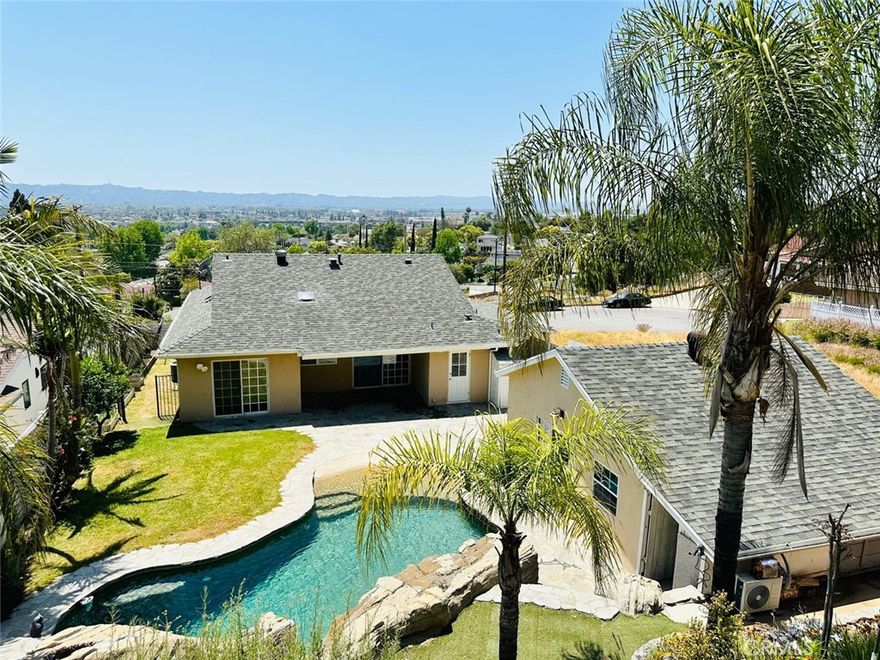 Nestled in the tranquil cul-de-sac of Burbank Hills, this meticulously maintained and tastefully remodeled home boasts breathtaking city views. Featuring a spacious open floor plan with main home offers three bedrooms and two bathrooms and back unit has an additional bonus room with bath which is good for a home office or guest retreat. The garage has been cleverly converted into ample storage space, while the expansive backyard offers a lavish private swimming pool with a cascading waterfall. Complete with a generously sized carport area equipped with an electric vehicle charger, this residence presents an unparalleled opportunity for luxurious living. Don't let this exceptional home slip through your fingers!