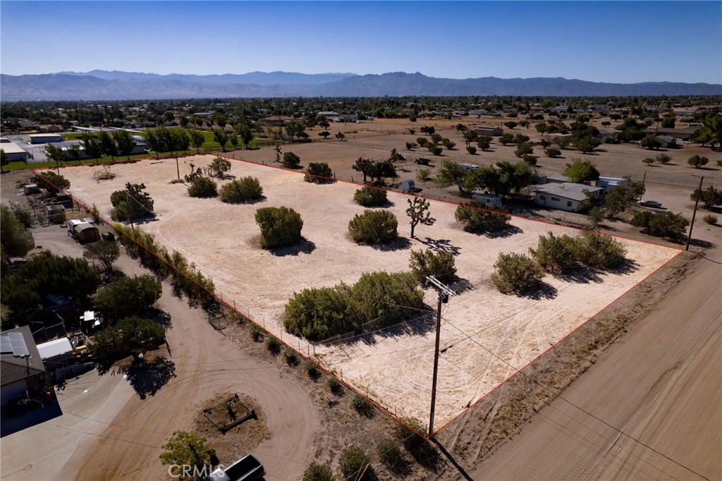 Welcome to this stunning 2.7-acre buildable horse property nestled in the highly desirable area of Southwest Hesperia. Perfectly positioned just a short distance from pavement, this flat, fully usable parcel offers the ideal canvas to bring your dream home to life. The land is fully fenced, providing both privacy and functionality, and utilities are conveniently located right at the property line - ready for immediate development. With wide open skies, tranquil surroundings, and plenty of space for horses, toys, or your custom retreat, this property truly has it all. Don’t miss this incredible opportunity - properties like this are rare and it won’t last long!