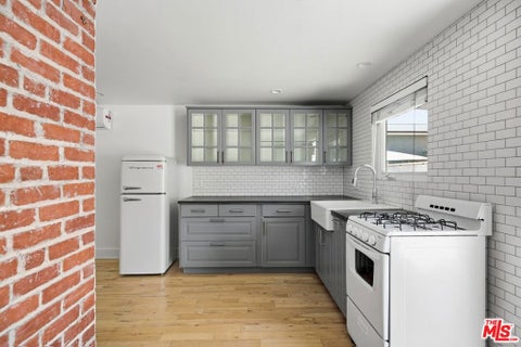 Photo of 213 1/2 N Avenue 49, Los Angeles, CA 90042 (MLS # 26101672)