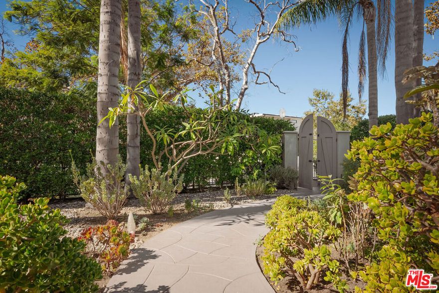 Blending classic Los Angeles elegance with refined modern design, this 1923 residence radiates timeless character and sophisticated comfort. Thoughtfully maintained and enhanced over the years, it showcases beautifully refinished original hardwood floors, a well-appointed kitchen with Viking appliances and a Sub-Zero refrigerator, and a seamless indoor-outdoor flow that opens to a lush private garden sanctuary. Mature greenery, fruit trees, and four fountains create an enchanting backdrop for entertaining or quiet retreat, while thoughtful upgrades including a new HVAC system, seismic foundation work, and Farrow & Ball non-toxic paints add modern ease to its historic charm. Ideally located near The Grove, LACMA, and Beverly Grove's finest dining and shopping, this home offers the serenity of a Parisian garden hideaway in the heart of the city.