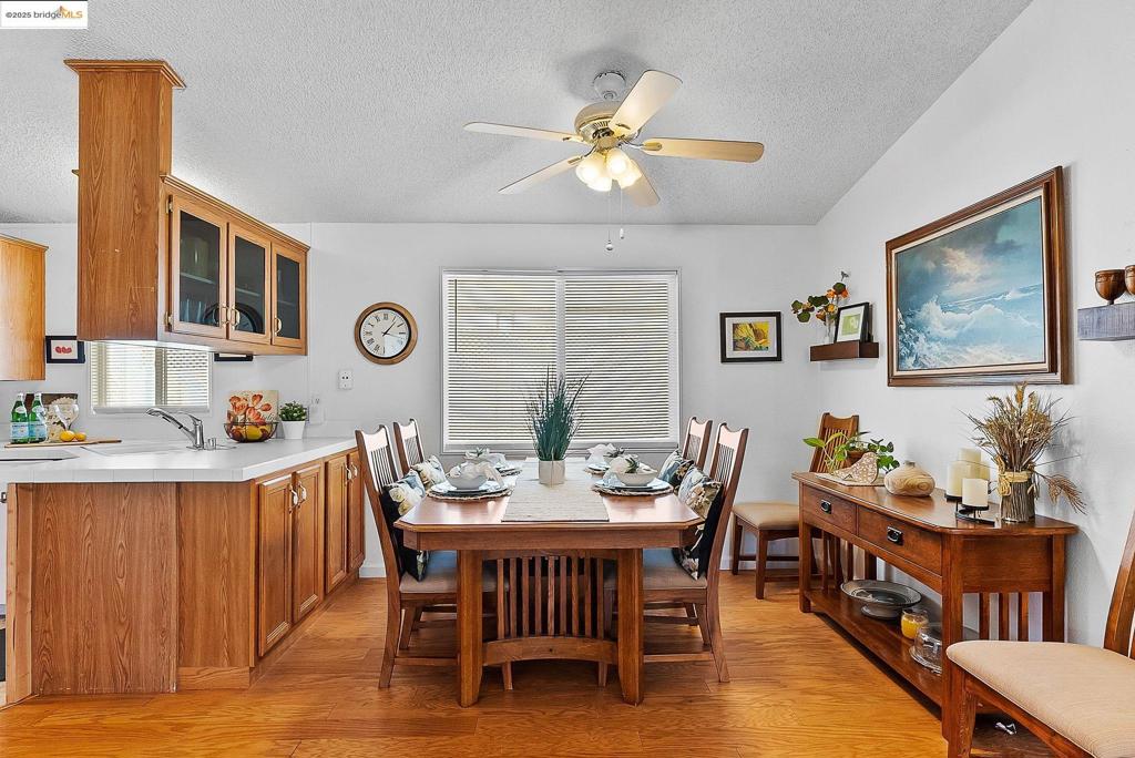 Don't miss seeing this lovely home located in a great 55+ community. This spacious double wide mobile home feels light and airy from the moment you walk thru the door. With 3 bedrooms, 2 baths, and a large open concept living room/dining room combo, that's great for entertaining. This home has had many upgrades, throughout: Newer stove, refrigerator, dishwasher & garbage disposal, rain gutters, interior paint, kitchen flooring, water heater, shed, just to name a few. And bonus! The exterior and trim will also be getting new paint, paid by the seller. The park has several nice color combinations to choose from, and you can pick your favorite! With a nice covered patio area and large side yard, this home offers even more space for outdoor dining, relaxing, or gardening. Located in the well-maintained lovely Eagle City 55+ Mobile Home Park that offers great amenities: A clubhouse, swimming pool, laundry room, and car wash area. This lovely park is located close to shopping, dining, Hwy 4, and many other conveniences. If you're looking for a larger size home that is move-in ready, you won't want to miss this one! Fireplaces: NO