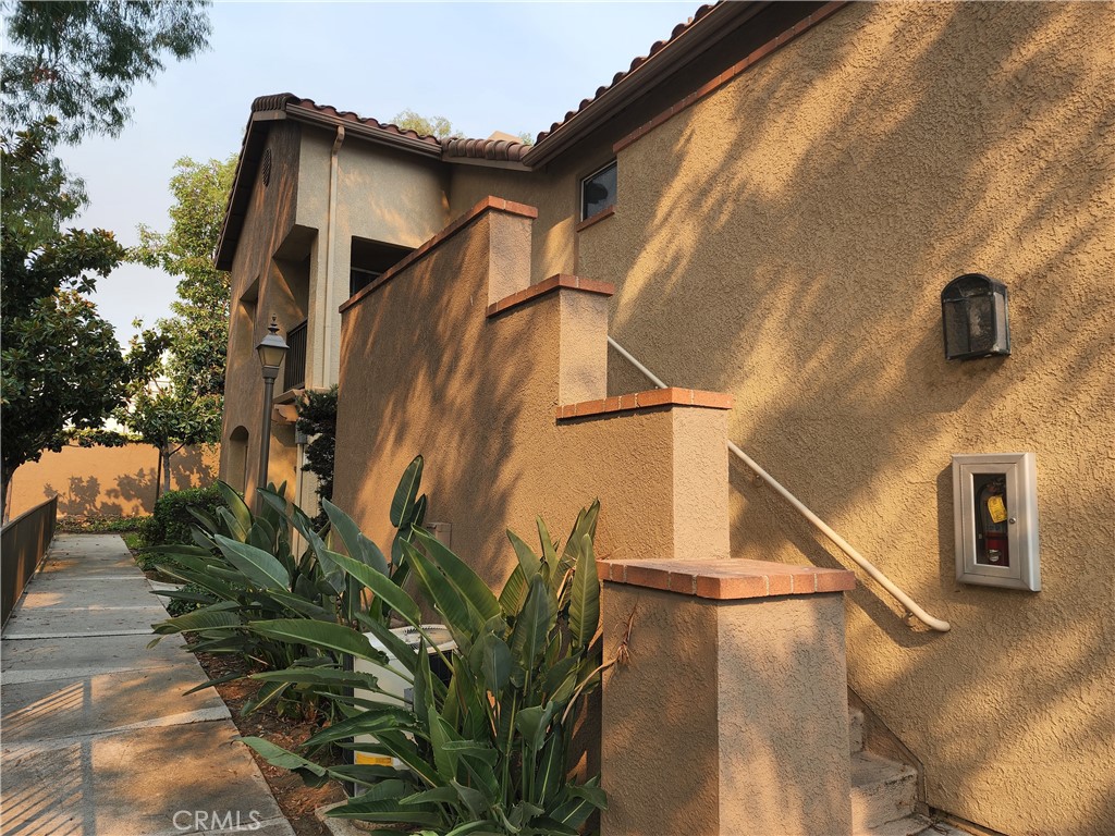 Beautifully upgraded upstairs condo in popular Rancho Santa Margarita. The kitchen has just been remodeled with white cabinets, quartz counter tops, refrigerator and a breakfast bar. The kitchen opens to the dining room for convenient meals. The dining room also has a vaulted ceiling. The living room features a fire place and leads to a balcony. There is WOOD look flooring throughout the home. Stay cool with the CENTRAL AIR CONDITIONING. The master bedroom has another balcony and two sets of closets. The en suite bathroom has dual sinks, bathtub, custom tiled shower, white cabinets, quartz counter tops and a seperate toilet room. There is a good size second bedroom. The hall bathroom has a custom tile shower, white cabinets plus quartz counter tops. There is an inside laundry room with side by side washer and dryer. In the hall you find a wall of storage/linen cabinets. There is a 1 CAR GARAGE with extra storage. You also have a covered carport. The community has a pool for your enjoyment!