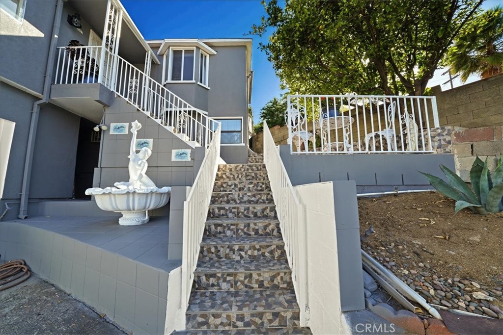 MULTIGENERATIONAL LIVING ON A HILLTOP— VIEWS VIEWS VIEWS + ADU + HUGE LOT!
Freshly painted inside and out with a brand new garage door, this Eagle Rock gem offers incredible potential! Located on a private easement just minutes from Eagle Rock or York Blvd, DTLA, Pasadena, and Occidental College, you’ll enjoy city convenience with hillside serenity. Only 8 miles to Downtown LA, 5 miles to Old Town Pasadena, and just blocks from Occidental College.
Inside, step into a bright and airy great room that seamlessly connects the living and dining areas—highlighted by panoramic city and hillside views and stunning sunsets. The kitchen features granite countertops and a charming bay window that floods the space with natural light. Adjacent to the kitchen is a spacious breakfast nook with direct access to the backyard. This flexible space can easily transform into a home office, playroom, media room, or even a third bedroom. A convenient laundry room at the rear of the home also offers separate access to the backyard and patio area. The two generously sized upstairs bedrooms each feature en-suite bathrooms with tiled counters, creating private retreats for residents or guests.
Downstairs, you’ll find a 632 sq ft ADU with its own private entrance. This thoughtfully designed unit includes 2 bedrooms, 1 bathroom, an open-concept living/dining area, and a kitchen with maple cabinets. It also has its own laundry/utility room, offering true independence and privacy—ideal for extended family or rental income.
Step outside to your private covered patio, surrounded by mature fruit trees including lemons and guavas—perfect for relaxing or entertaining. The expansive lot provides abundant space for gatherings, parking, or even adding more ADUs to generate passive income. BONUS: garage has all utilities located right behind for easy conversion.
This rare property also includes an extra lot, giving you even more room to customize and expand.
Don’t miss this opportunity—schedule a showing today and unlock the full potential of this unique hillside retreat!